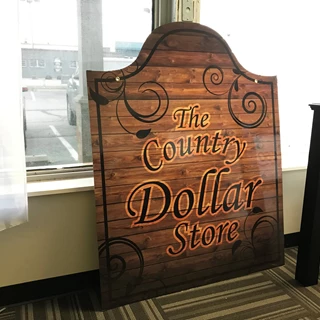 Scroll Bracket Sign for The County Dollar Store